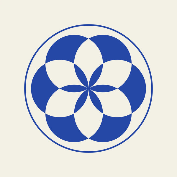 Rosette geometric paper coaster design from the Blue Shapes collection in cobalt blue and cream