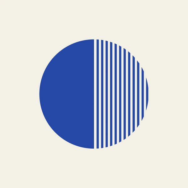 Half Light striped circle paper coaster design from the Blue Shapes collection in cobalt blue and cream