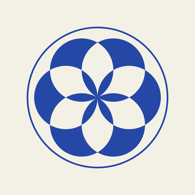 Rosette geometric paper coaster design from the Blue Shapes collection in cobalt blue and cream