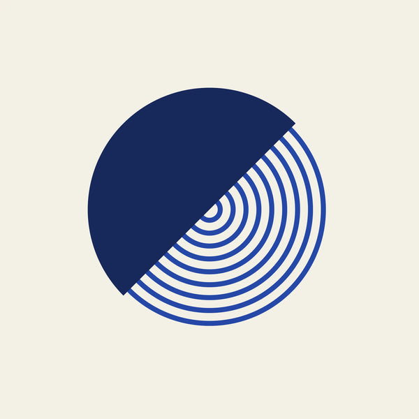 Split diagonal circle paper coaster design from the Blue Shapes collection in navy, cobalt and cream