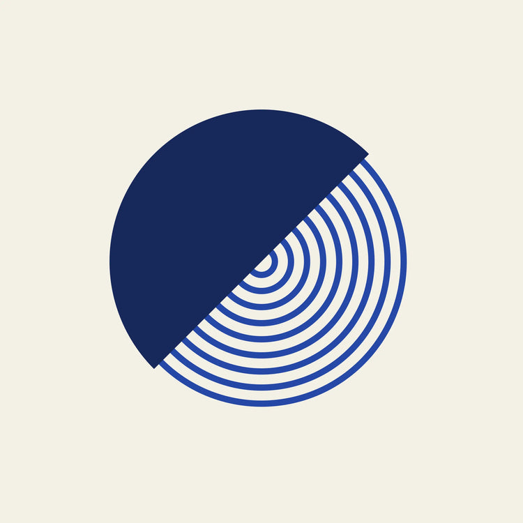 Split diagonal circle paper coaster design from the Blue Shapes collection in navy, cobalt and cream
